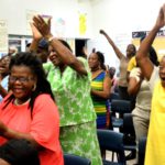 Attendees of the Lodge Town Hall Meeting jubilantly welcome Prime Minister Dr. the Honourable Timothy Harris