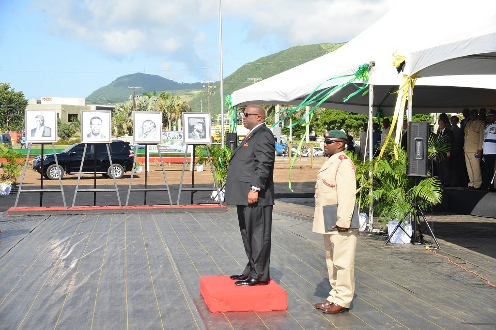 Prime Minister Harris on the saluting dais on National Heroes Day at site for construction of National Heroes Park