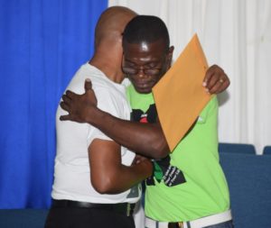 Travis DuPorte embraces Dr. Chitan 